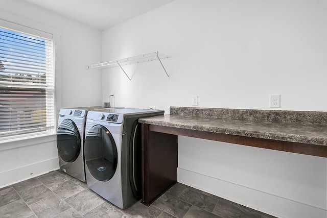 laundry area featuring washing machine and clothes dryer