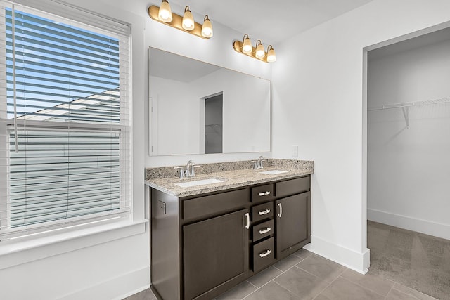 bathroom with vanity and tile patterned flooring