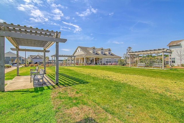 view of yard with a pergola and a patio area