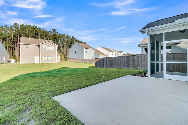 view of yard with cooling unit and a patio area