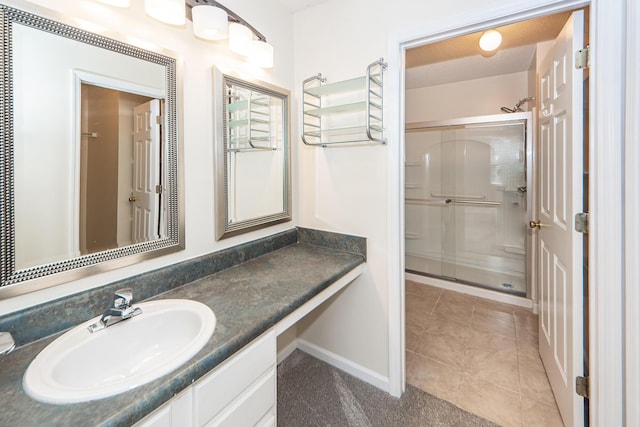 bathroom featuring vanity, tile patterned flooring, and walk in shower