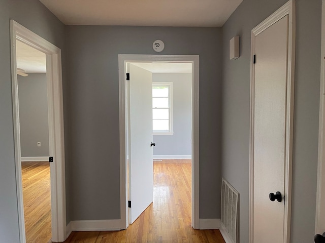 hall with light hardwood / wood-style floors