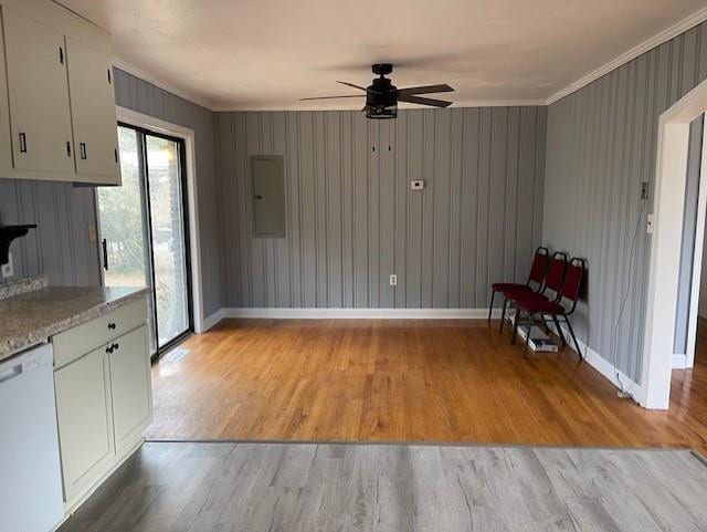 kitchen with light wood-type flooring, ceiling fan, white cabinets, crown molding, and dishwasher