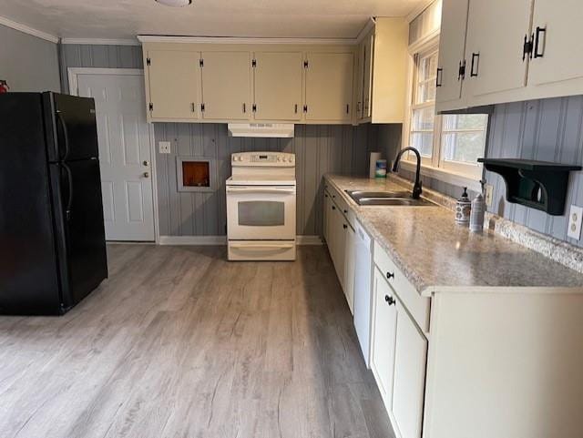 kitchen with white appliances, sink, light wood-type flooring, and white cabinetry