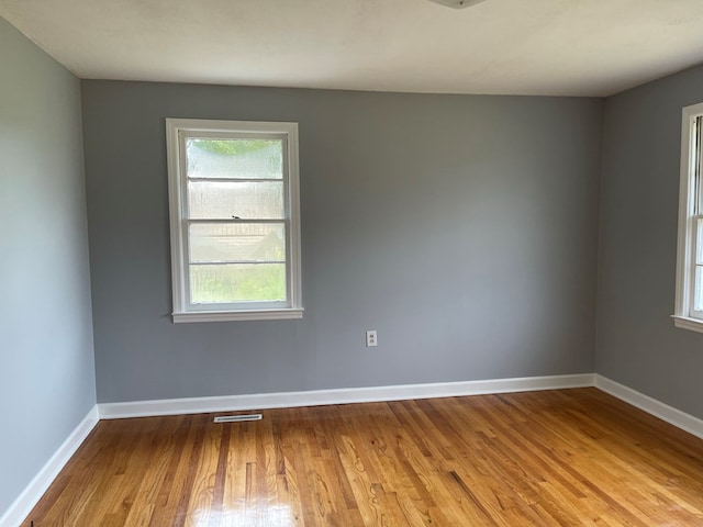 unfurnished room featuring light hardwood / wood-style floors