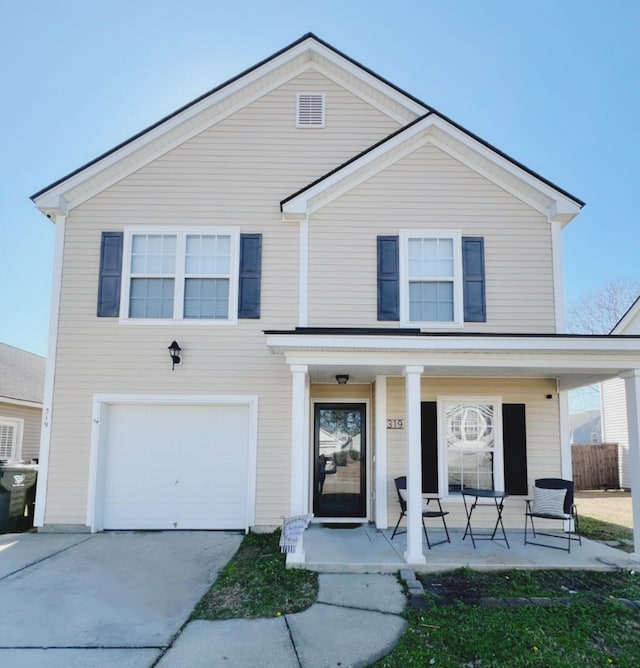 view of front of house featuring a garage and covered porch