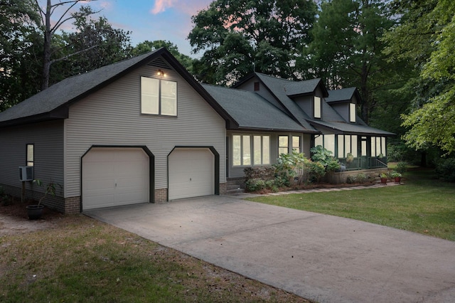 2144 Pinopolis Rd, Pinopolis, SC 29469 - view of front facade featuring an attached garage, roof with shingles, a yard, and concrete driveway