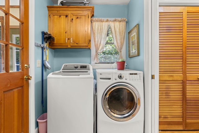 2144 Pinopolis Rd, Pinopolis, SC 29469 - washroom featuring cabinet space and washing machine and clothes dryer