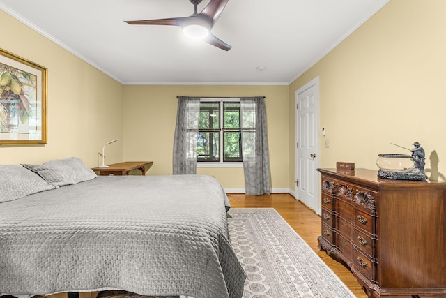 2144 Pinopolis Rd, Pinopolis, SC 29469 - bedroom with a ceiling fan, baseboards, light wood-style floors, and ornamental molding