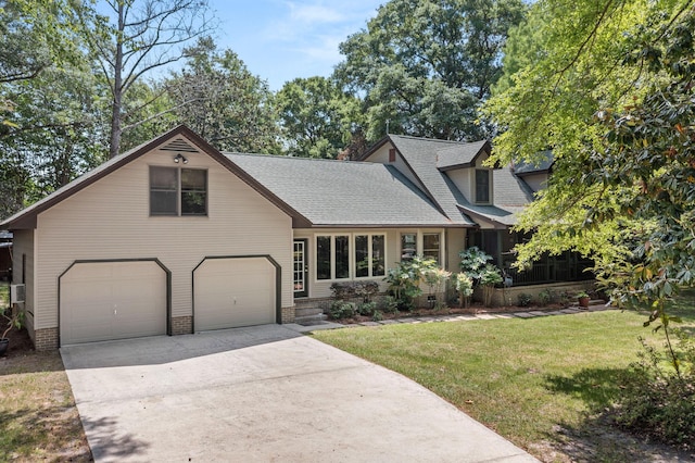 2144 Pinopolis Rd, Pinopolis, SC 29469 - view of front of home featuring an attached garage, a shingled roof, a front lawn, and driveway