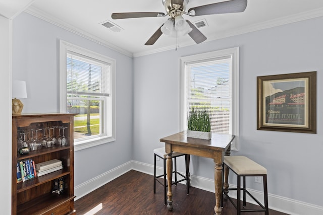 office space with ceiling fan, visible vents, baseboards, ornamental molding, and dark wood-style floors