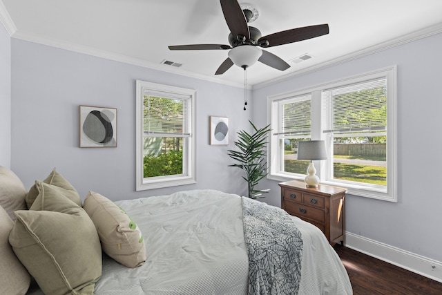 bedroom with baseboards, visible vents, dark wood-style floors, and multiple windows