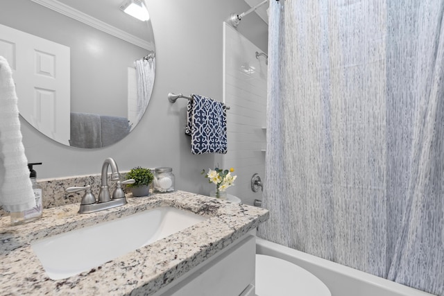 full bathroom featuring toilet, ornamental molding, vanity, and shower / bath combo with shower curtain
