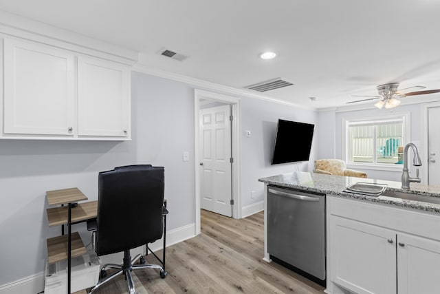 kitchen with a sink, dishwasher, white cabinets, baseboards, and visible vents