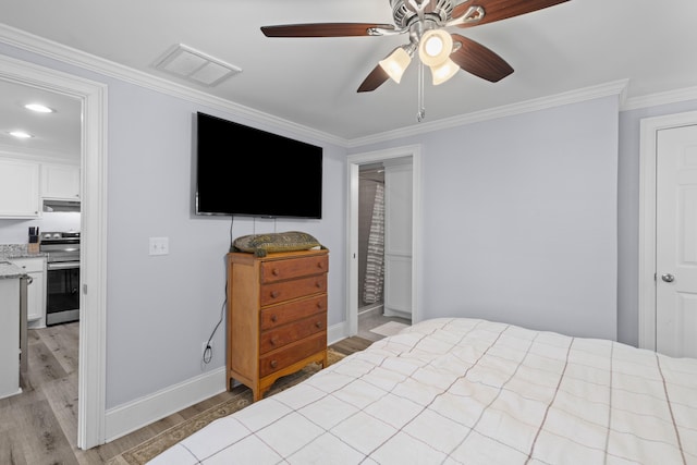 bedroom featuring light wood-type flooring, baseboards, visible vents, and crown molding