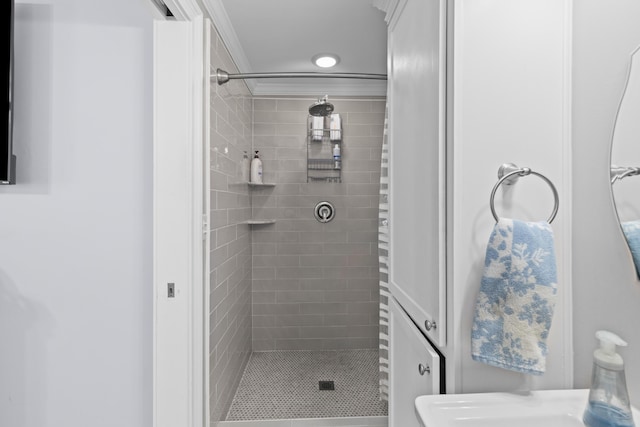 full bathroom featuring a shower stall and crown molding