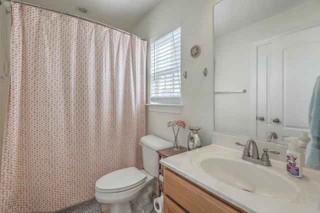 full bathroom featuring a textured ceiling, toilet, vanity, and a shower with curtain