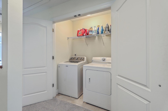 clothes washing area featuring laundry area and separate washer and dryer