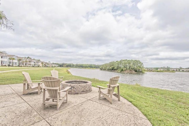 view of patio / terrace with a water view and a fire pit