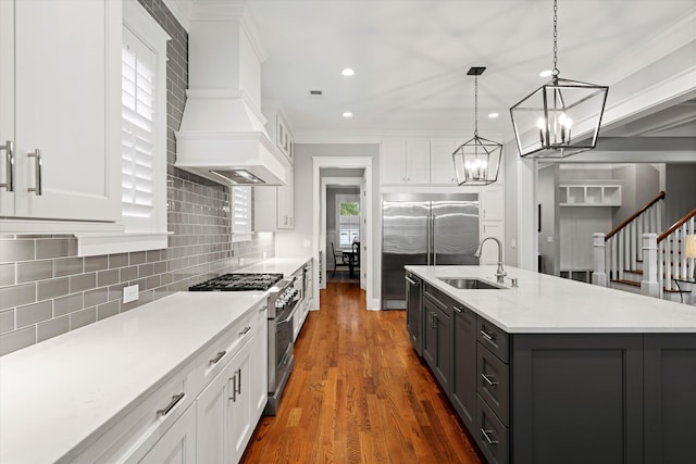 3739 Goodwater St, Mount Pleasant, SC 29466 - kitchen featuring high end appliances, a sink, white cabinetry, premium range hood, and recessed lighting