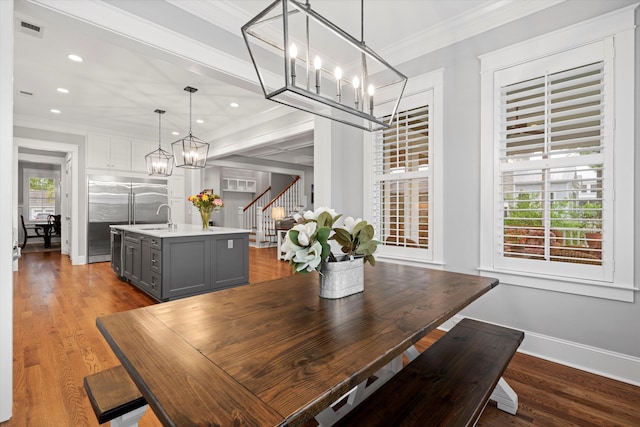 3739 Goodwater St, Mount Pleasant, SC 29466 - dining space with a chandelier, stairs, wood finished floors, baseboards, and ornamental molding