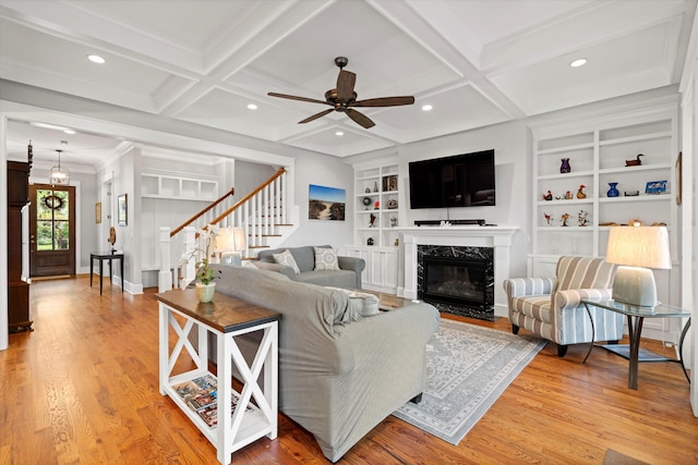 3739 Goodwater St, Mount Pleasant, SC 29466 - living room featuring a ceiling fan, light wood-style floors, stairs, built in features, and a fireplace