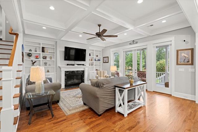 3739 Goodwater St, Mount Pleasant, SC 29466 - living area with french doors, a ceiling fan, light wood-style flooring, stairway, and coffered ceiling