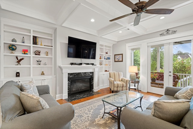 3739 Goodwater St, Mount Pleasant, SC 29466 - living room featuring built in shelves, light wood finished floors, a premium fireplace, coffered ceiling, and recessed lighting