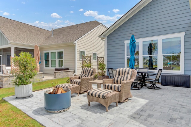 view of patio / terrace featuring an outdoor living space with a fire pit