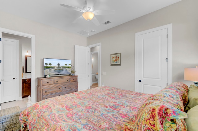 bedroom featuring ceiling fan and connected bathroom