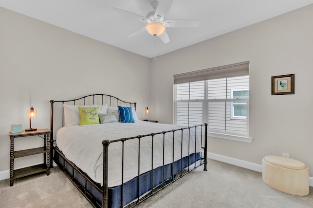 bedroom featuring ceiling fan and light colored carpet