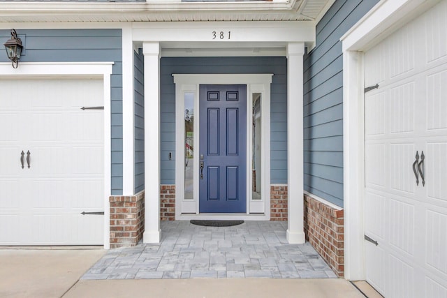 doorway to property featuring a garage