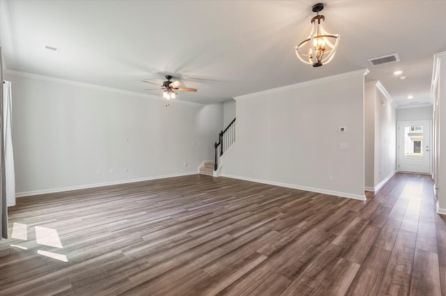 unfurnished living room featuring visible vents, crown molding, baseboards, ceiling fan with notable chandelier, and stairs