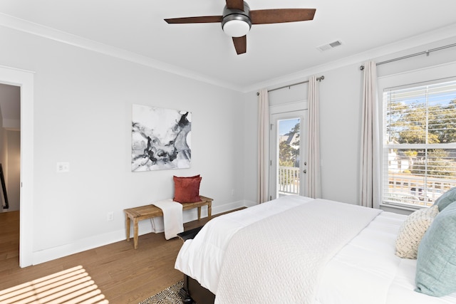 bedroom featuring ceiling fan, wood-type flooring, ornamental molding, and access to outside