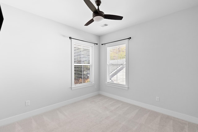 empty room with light carpet and ceiling fan