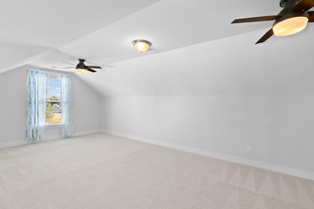 bonus room featuring light carpet, ceiling fan, and vaulted ceiling