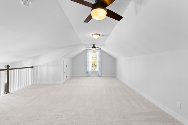 bonus room with ceiling fan, light colored carpet, and lofted ceiling