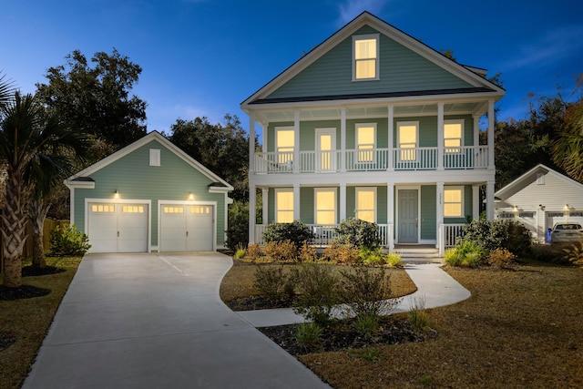 greek revival house with covered porch and a garage