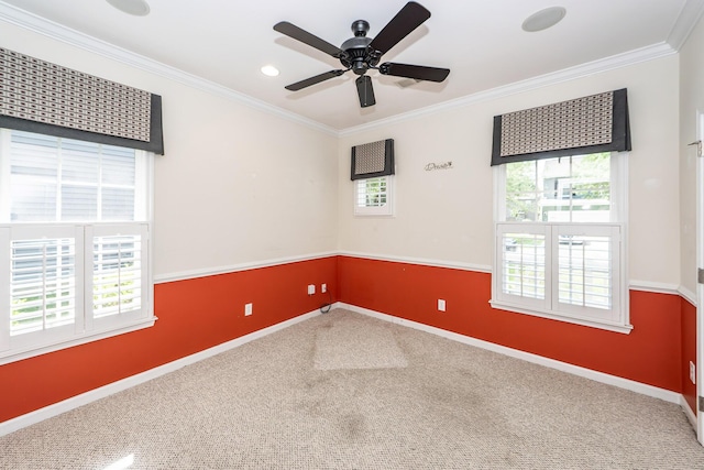carpeted empty room with crown molding, baseboards, a ceiling fan, and recessed lighting