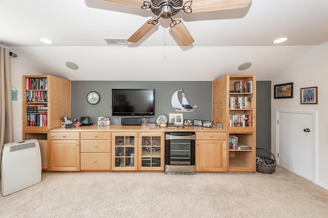 living room with beverage cooler, light colored carpet, vaulted ceiling, ceiling fan, and recessed lighting