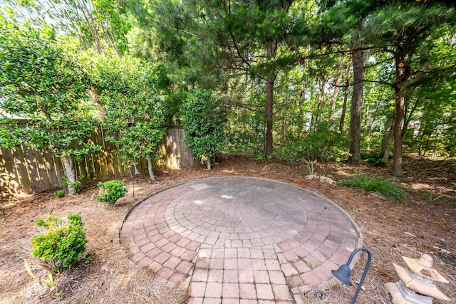 view of patio / terrace featuring fence