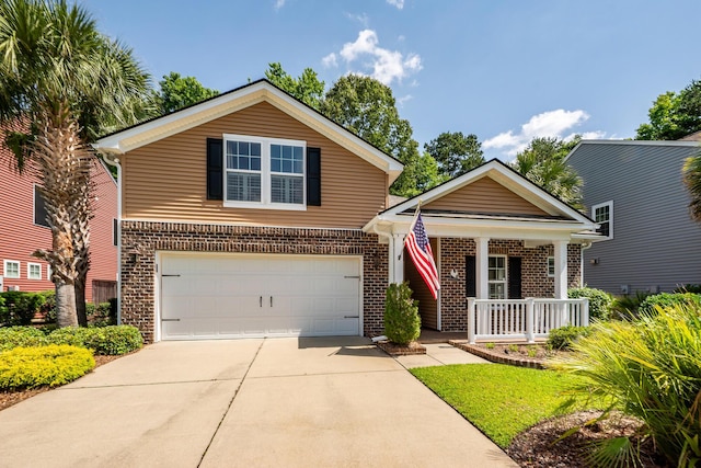 traditional-style home with brick siding, a porch, concrete driveway, and a garage
