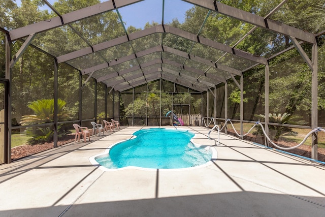 view of pool with a lanai and a patio