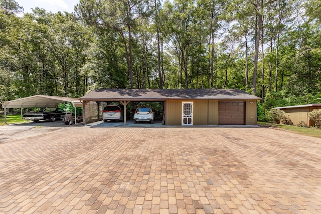 view of front facade with a carport and a garage