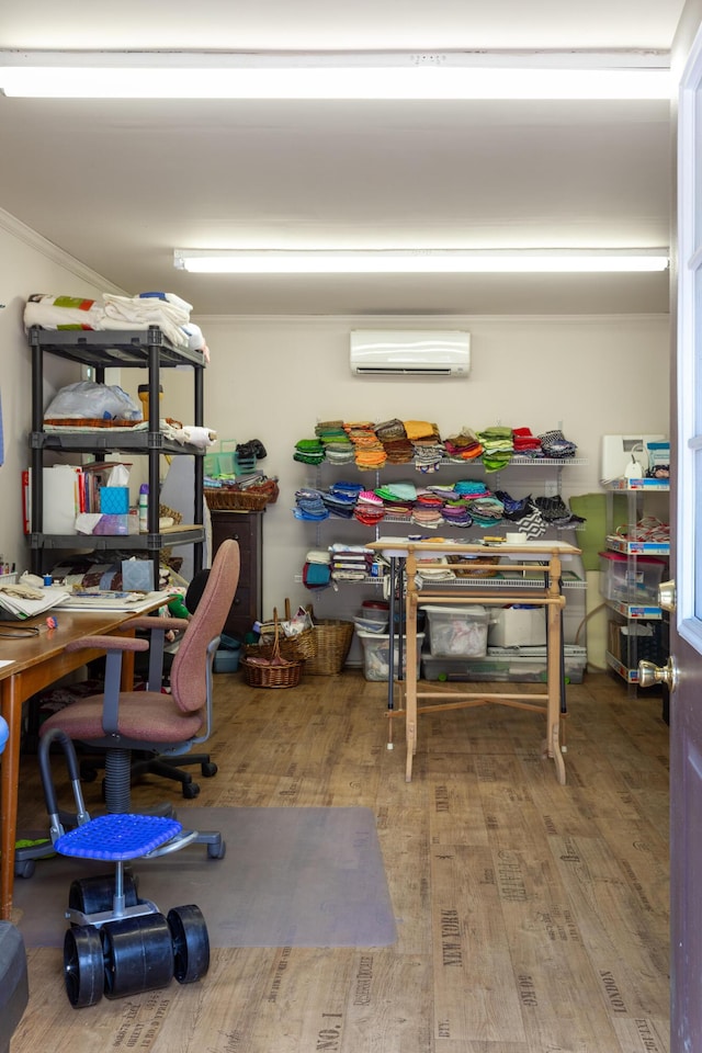 office featuring a wall mounted air conditioner and hardwood / wood-style floors