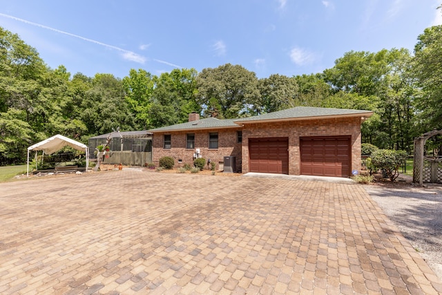 single story home with a garage and a carport