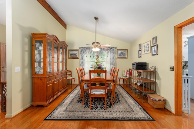 dining area featuring ceiling fan, lofted ceiling, and light hardwood / wood-style floors