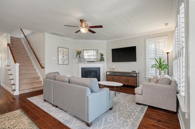 2627 Rutherford Way, Charleston, SC 29414 - living area with dark wood-type flooring, ceiling fan, stairway, ornamental molding, and a glass covered fireplace