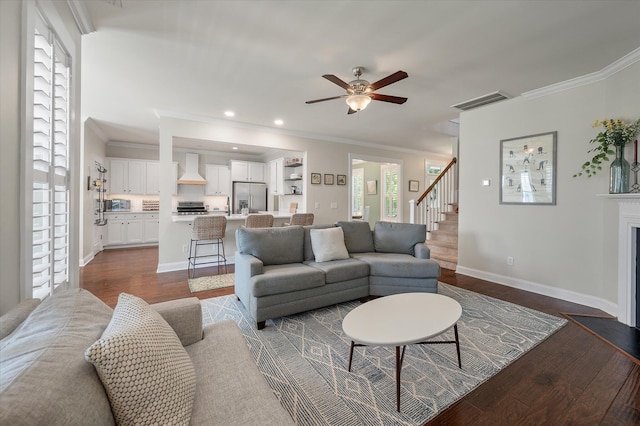 2627 Rutherford Way, Charleston, SC 29414 - living room with dark wood-style floors, ornamental molding, a ceiling fan, baseboards, and stairs