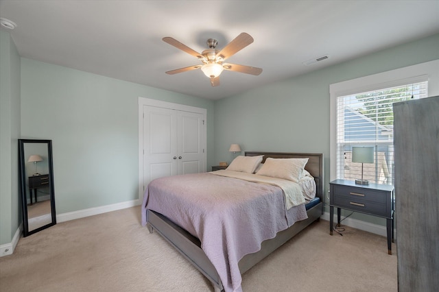 2627 Rutherford Way, Charleston, SC 29414 - bedroom featuring baseboards, light carpet, a closet, and ceiling fan